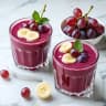 Fresh Grape Smoothie in Glass with Purple Grapes